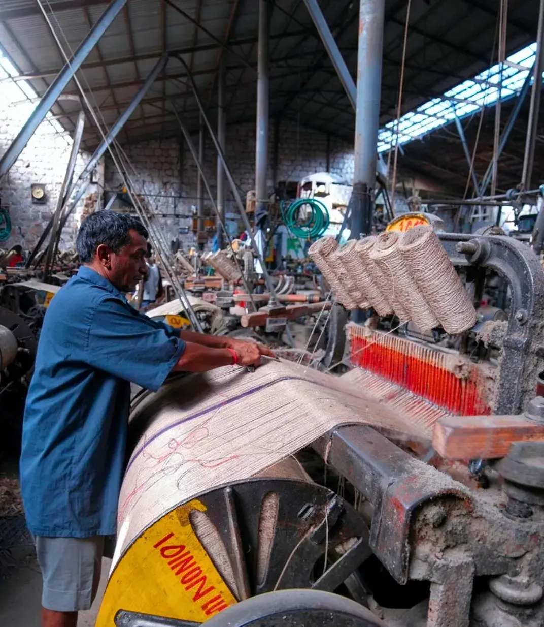 man working in a jute mashine