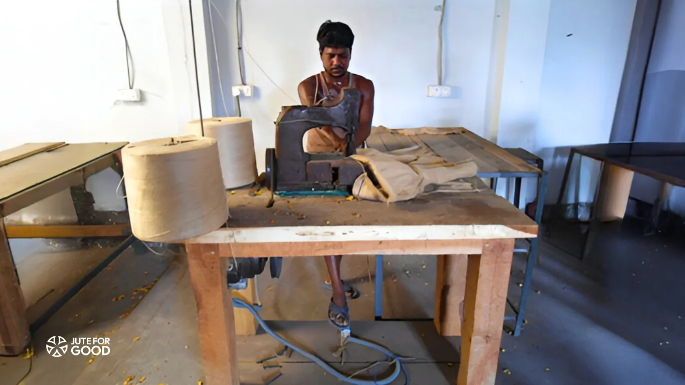 a man stitching jute bags